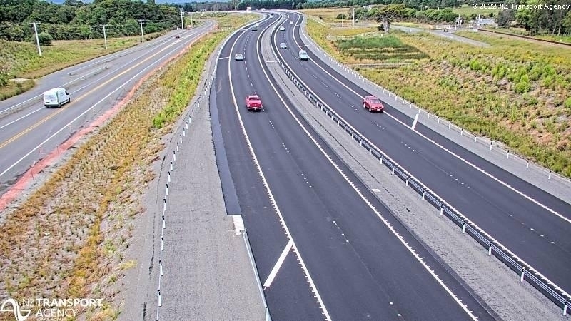 traffic camera view of a new, largely empty expressway 