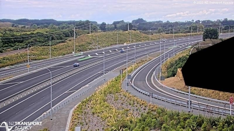 traffic camera view of a new, largely empty expressway 
